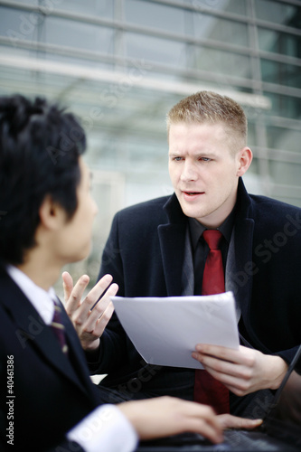 Photo: Businessmen having discussion. Businessmen having discussion.