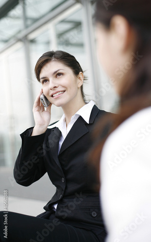 Photo: Businesswoman talking on the handphone. Businesswoman talking on the handphone.