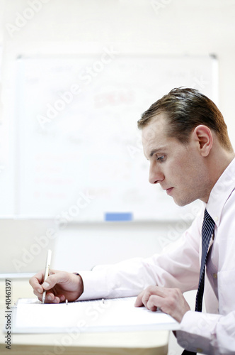 Photo: Businessman concentrating on his work. Businessman concentrating on his work.