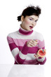 Woman eating blood orange.