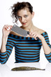 Photo: Woman preparing to cut a fish. Woman preparing to cut a fish.