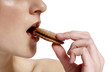 Photo: Woman eating biscuit. Woman eating biscuit.