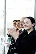 Photo: Corporate people clapping hands in the meeting room. Corporate people clapping hands in the meeting room.