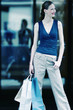 Woman carrying paper bags.