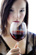 Woman holding a glass of red wine.