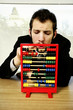 Businessman playing with children abacus.