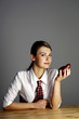 Businesswoman holding a red pear.