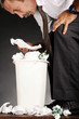 Businessman ransacking a dustbin.