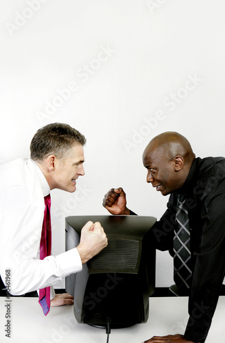 Photo: Businessmen challenging each other. Businessmen challenging each other.