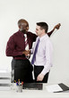 Businessman stabbing his colleague with a knife while shaking his hand.