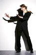 Businessman being blown by strong wind.