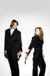 Businessman and businesswoman being cuffed together.