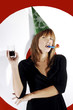 Photo: Businesswoman with party hat celebrating. Businesswoman with party hat celebrating.