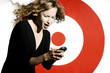 Businesswoman text messaging on her handphone.
