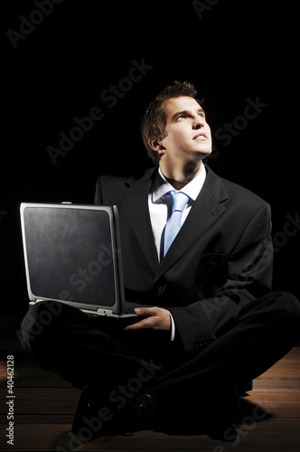 Photo: Businessman using laptop. Businessman using laptop.