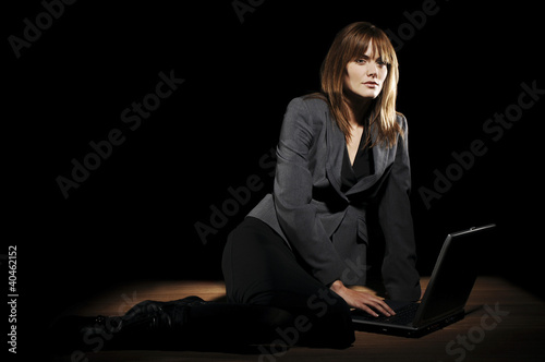 Photo: Businesswoman using laptop. Businesswoman using laptop.