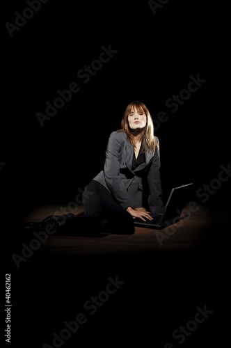 Photo: Businesswoman using laptop. Businesswoman using laptop.