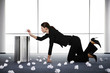 Businesswoman picking up the rubbish.