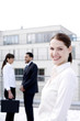 Foto: Businesswoman smiling at the camera. Businesswoman smiling at the camera.