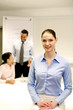 Foto: Businesswoman smiling at the camera. Businesswoman smiling at the camera.