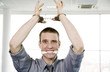Businessman with his hands being cuffed and his mouth being stuffed with cloth.