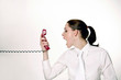 Businesswoman screaming into the phone.