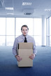 Photo: Businessman staying in a box. Businessman staying in a box.