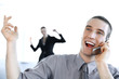 Businessman talking happily on the mobile phone.