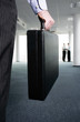 Businessman carrying a briefcase.