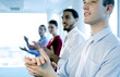 Business people clapping hands after watching a great presentation.