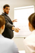 Foto: Businessman giving presentation in the conference room. Businessman giving presentation in the conference room.