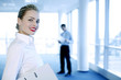 Businesswoman flashing a wide smile at the camera.