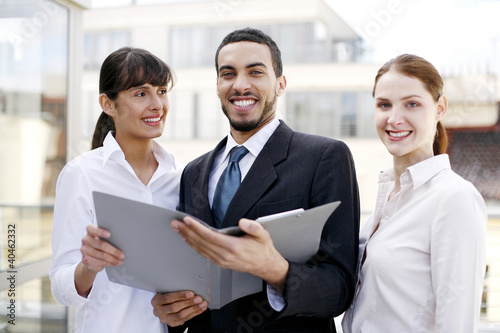 Photo: Business people posing in a group. Business people posing in a group.