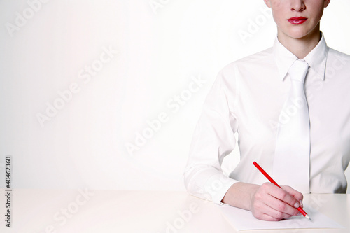 Photo: Businesswoman writing. Businesswoman writing.
