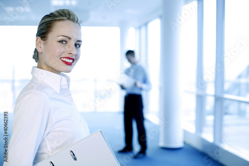 Photo: Businesswoman flashing a wide smile at the camera. Businesswoman flashing a wide smile at the camera.
