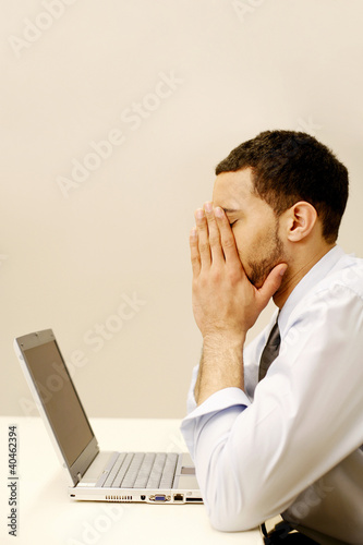 Photo: An overworked businessman. An overworked businessman.