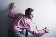 Businessman eavesdropping with a stethoscope.