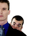 Foto: Businessman hiding behind his colleague. Businessman hiding behind his colleague.
