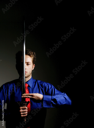 Photo: Businessman practicing martial art. Businessman practicing martial art.