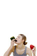 Woman eating capsicum.