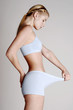 Foto: Woman checking her tummy. Woman checking her tummy.
