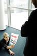 Businesswoman submitting an urgent sales report.