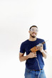 Man with goggles holding a drill.