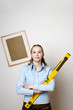 Woman holding a spirit level.