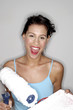 Woman holding a paint roller and a paint tray.