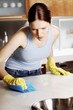 Woman wiping the table.