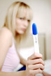 Woman showing her pregnancy test result.