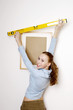Woman using spirit level.