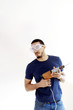Man with goggles holding a drill.