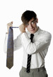 Foto: Businessman holding a tie. Businessman holding a tie.